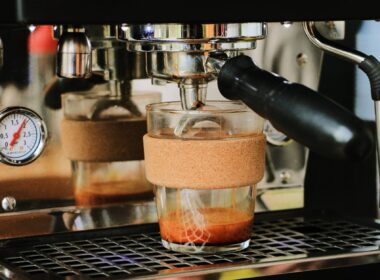 clear coffee glass on silver espresso machine